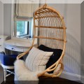 F32. Serena & Lily hanging rattan swing chair. 